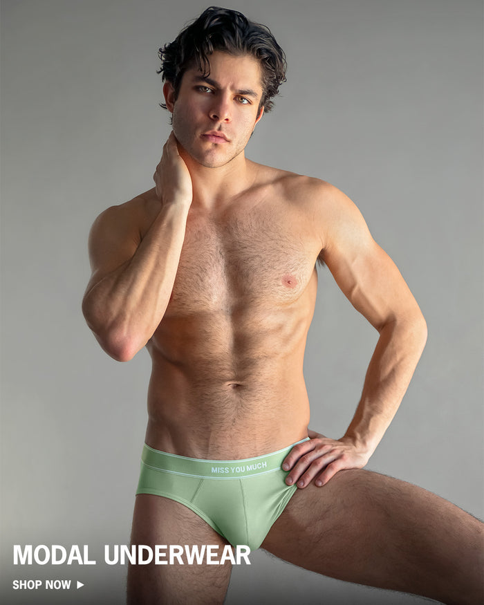 Man wearing light green underwear with 'Modal Underwear' text on a gray background