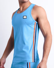 Side view of the COASTAL BLUE beach quick-dry tank top for men features a in a solid blue color, made by DC2 a capsule brand by BANG! Clothes in Miami.