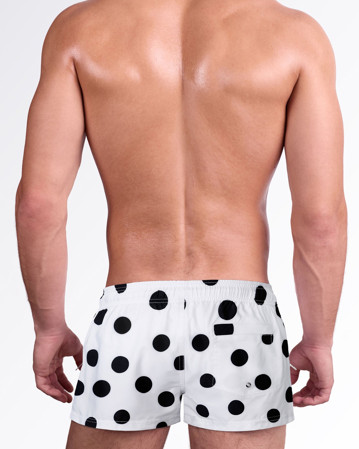 Connect The Dots men’s swim shorts with allover black dot print, rear pocket detail, elastic waistband, and lightweight beach-ready fabric.