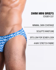 Infographic explaining the features of the ESCAPADE (BLUE/WHITE) Swim Mini-Brief made by BANG! Clothes. These edgier cut mens swimsuit are minimal skin coverage, sculpts waistline, sits low for sexier look, and 4-way stretch fabric.