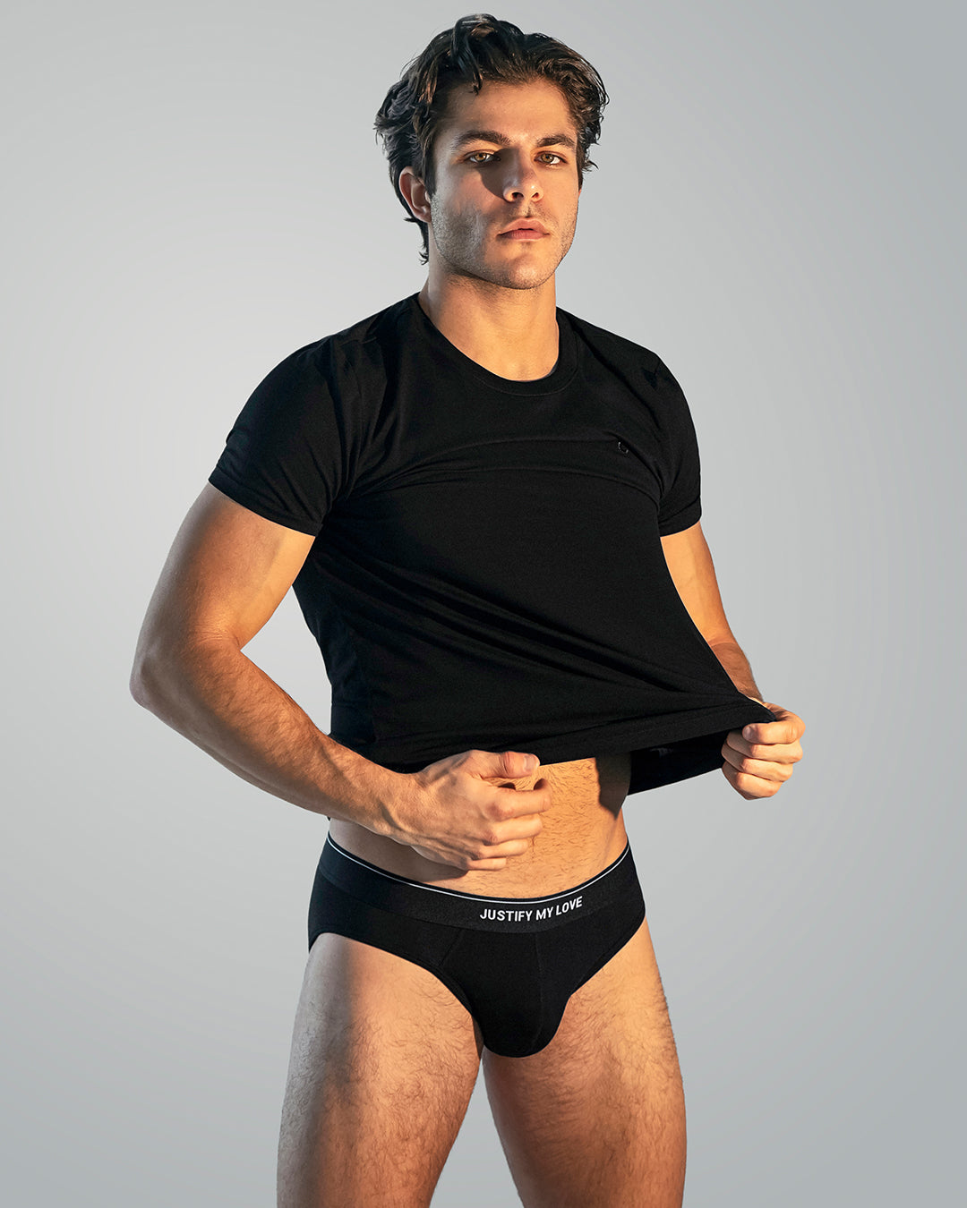 DC2 Justify My Love modal briefs and black modal-cotton T-shirt worn by male model, premium men’s basics designed for a smooth fit and everyday comfort.