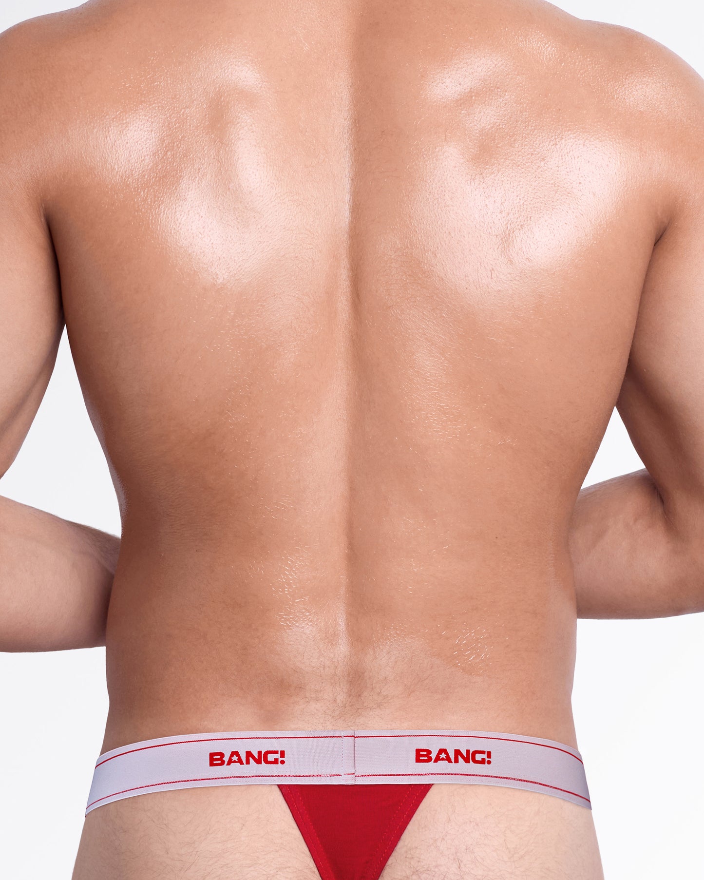 Back view of the Heated Red Skin Soft Thong, showing the minimal thong silhouette and white elastic logo waistband.