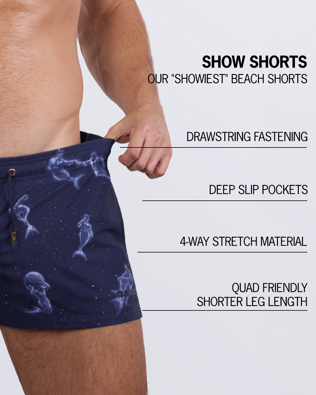 Detailed close-up of the MERMEN MASTERS Show Shorts, showcasing their standout features: drawstring fastening, deep slip pockets, 4-way stretch material, and a quad-friendly leg length for modern beachwear style.