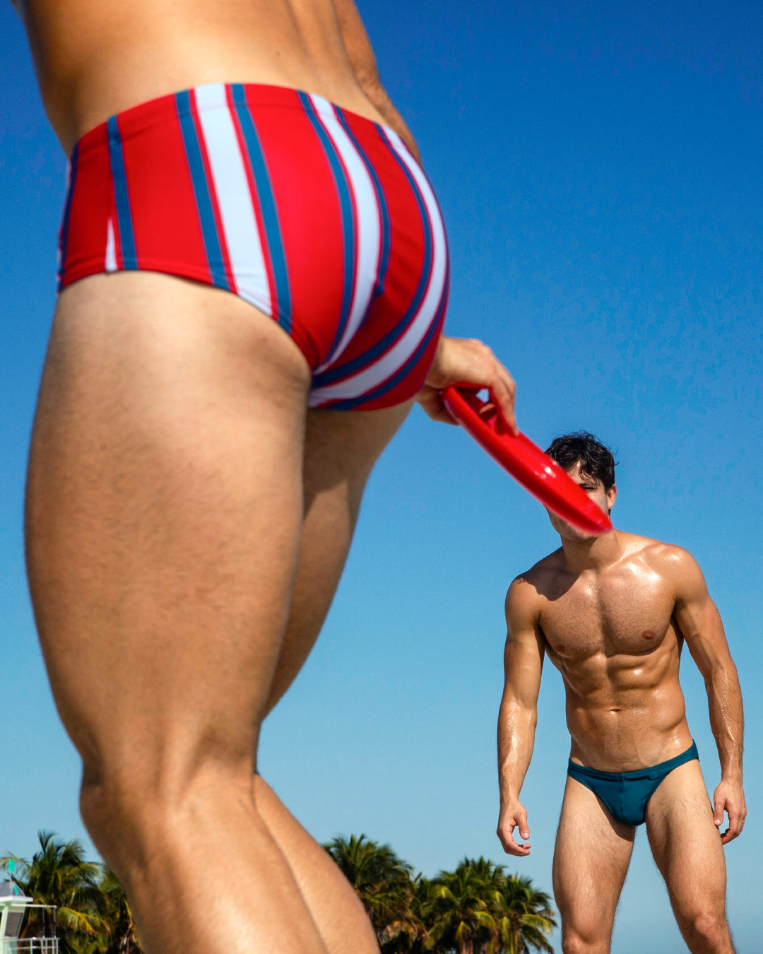 DC2 Swift Stripes and Chic Teal Series — featuring the Swift Stripes Swim Sunga and Chic Teal Swim Mini Brief, both crafted from quick-dry stretch fabric for a sleek beach look.