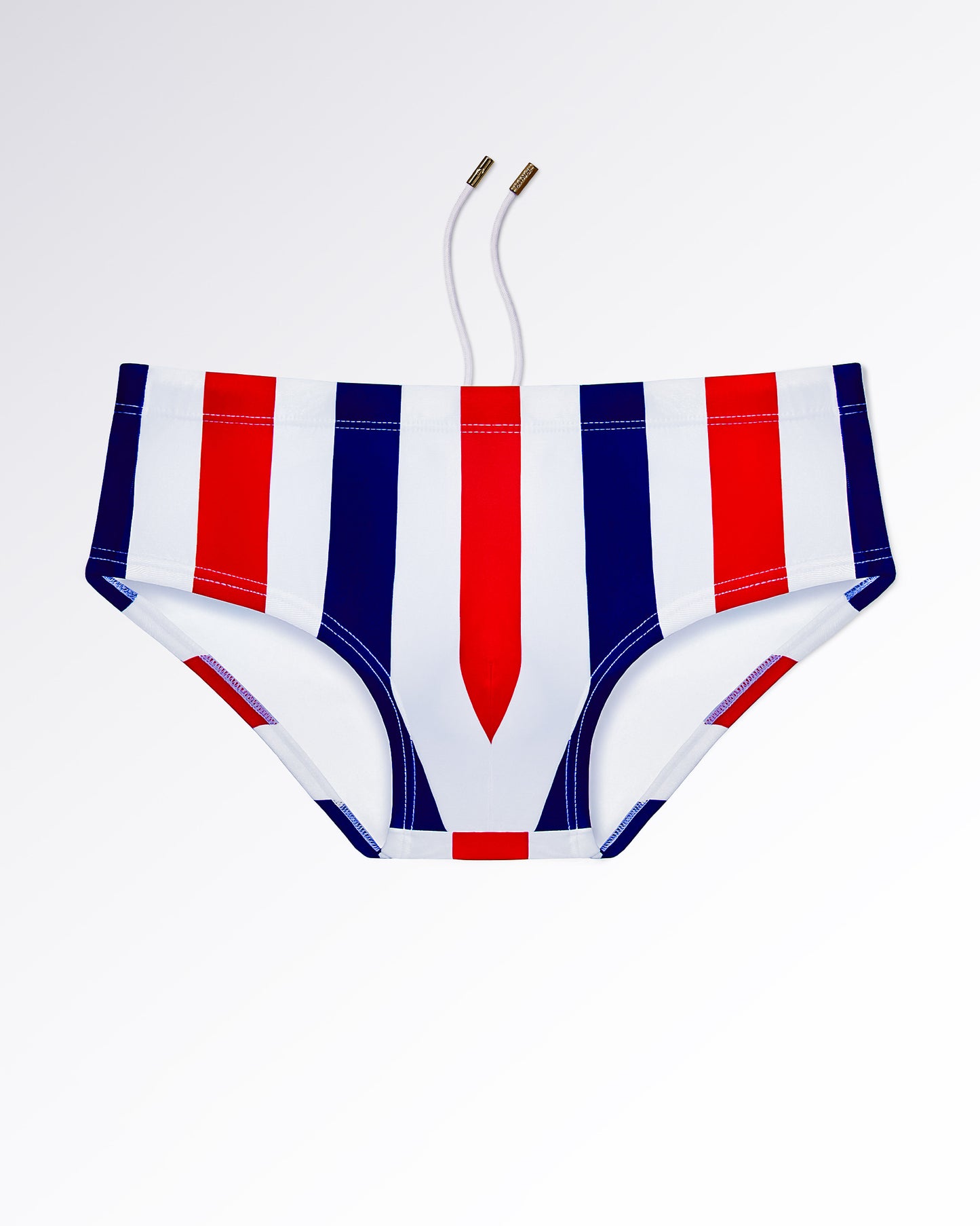 BANG! Miami The Ken (Saint-Tropez Edition) Swim Sunga — flat lay of white swim sunga with bold red and navy vertical stripe pattern and retro Riviera-inspired design.