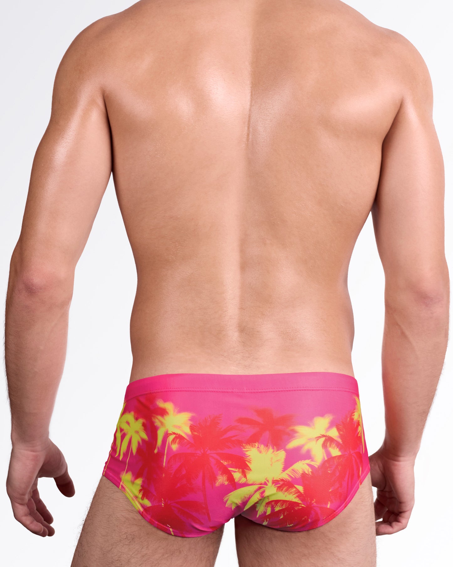 BANG Wuthering Heights (Fucsia) Swim Sunga — back view showcasing full tropical palm graphic in high-contrast sunset tones, smooth tailored fit, and clean finish.