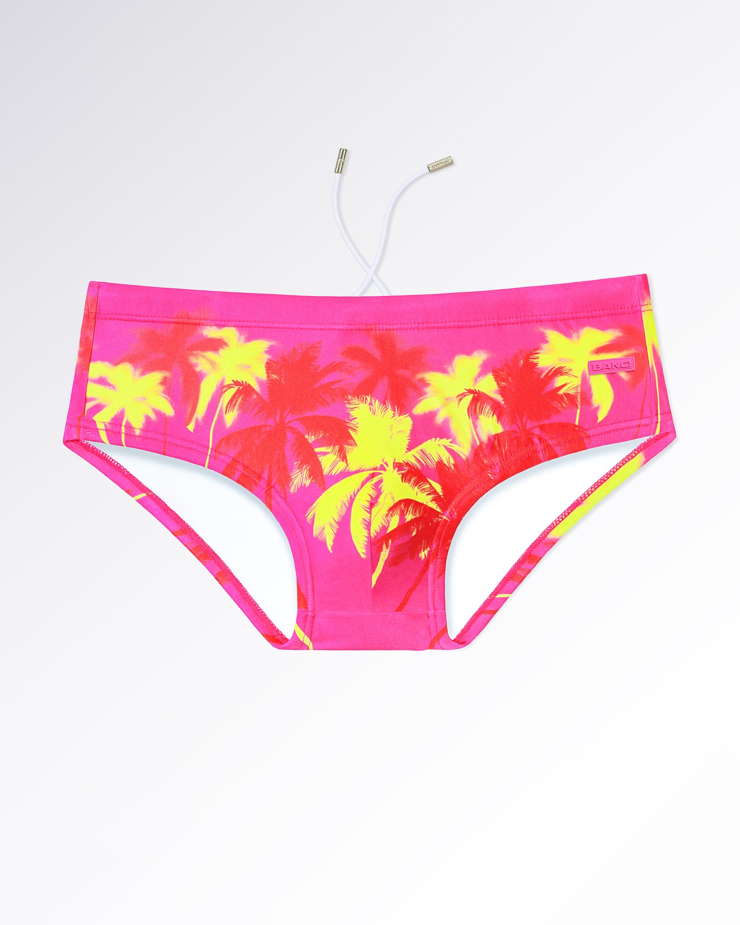 BANG! Miami Wuthering Heights (Fucsia) Swim Sunga — flat lay of neon pink swim sunga with vibrant yellow palm tree print and tropical-inspired design.