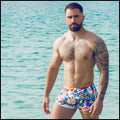 These men's swim shorts feature fun and enegetic comics-style graphics in bold colors, with a prominent BANG! illustration.