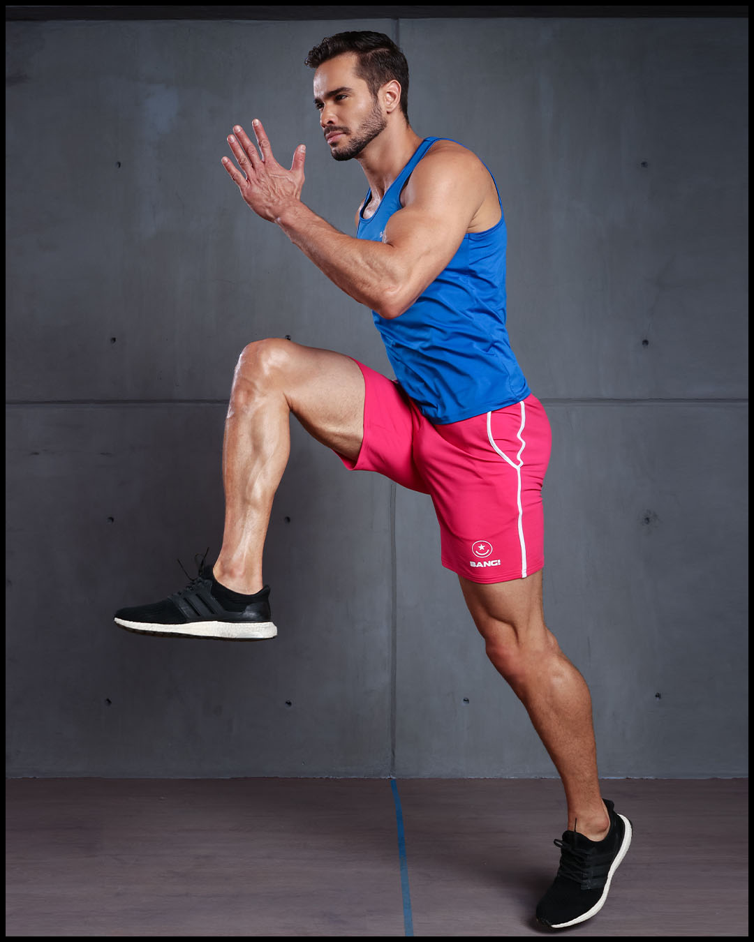 Frontal view of BANG!'s men's pink calisthenical Shorts in the style of classic men’s running shorts for workout, fitness or bodybuilding.