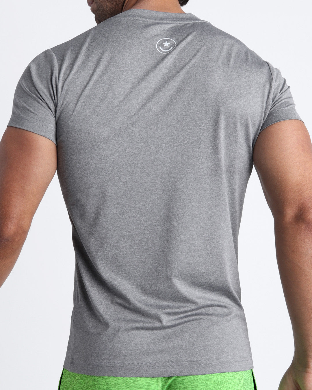 Back view of the COMPOUND GREY men's fitness shirt in a stone gray color by BANG! menswear Miami.