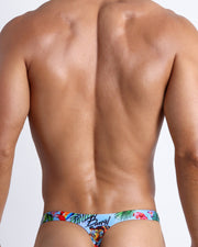 Back view of a sexy male model wearing DISCO JUNGLE  men’s swim bikini made by the Bang! official brand of men's beachwear.