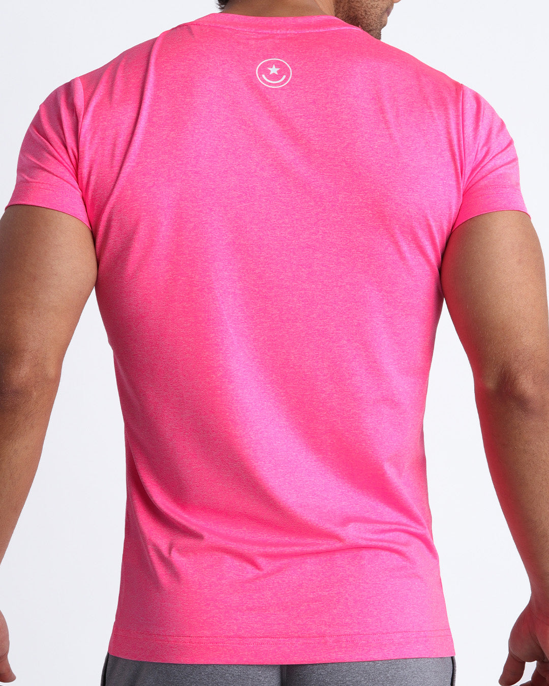 Back view of the PINKTENSITY men's fitness shirt in a neon pink color by BANG! menswear Miami.