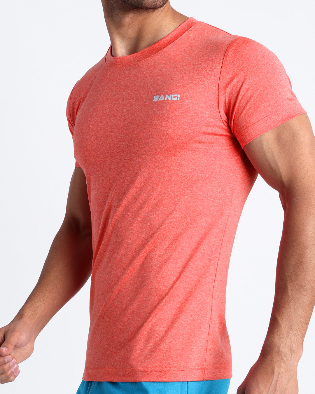 Side view of men’s exercise tee in a red color made by BANG! Clothing the official brand of mens beachwear.