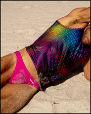 Male model wearing the CONFESSIONS ON A SAND FLOOR Tank Top and the CONFESS MAGENTA Swim Mini-Brief by BANG! Clothes the official brand of men’s swimwear brand based in Miami, FL.