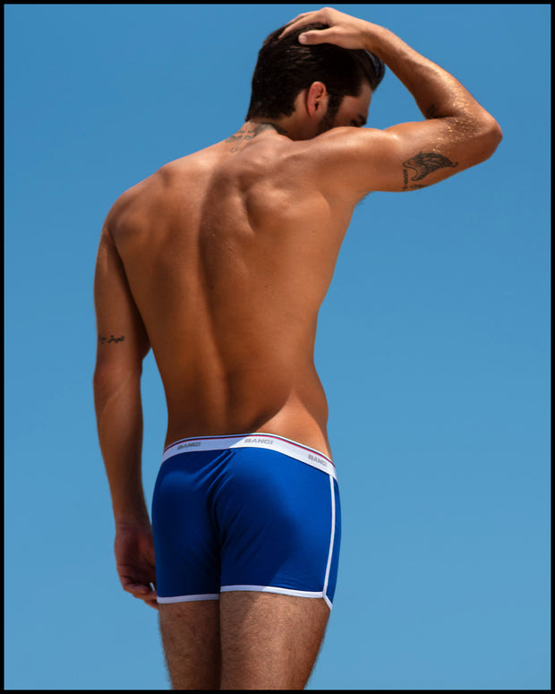 Male model outdoors in Brazil wearing the BLUE AMBITION Cotton Boxer Brief by BANG! Clothes. The underwear design is inspired by the same tighty-whities as worn by Tom Cruise in that iconic scene from the Risky Business movie.