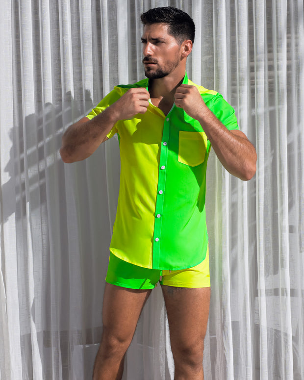 Model wearing the Single Bilingual (Neon Yellow/Green) beachwear set. The set consists of a comfortable, breathable Hawaiian stretch shirt in a neon color-block design, with matching show shorts.
