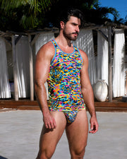 Model wearing DC2 Miami CAMO POP (Neon Mix) Tank Top and matching Swim Mini Brief, featuring a bold, vibrant camouflage pattern in neon colors.