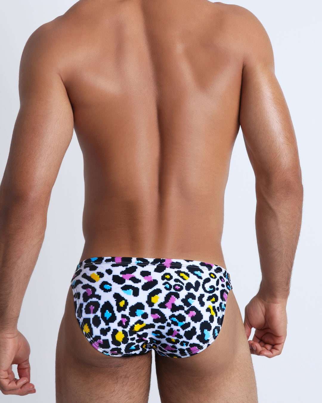 Back view of the 8-BIT POP LEOPARD beach briefs for men by BANG! menswear Miami with pixelated sprite graphics.
