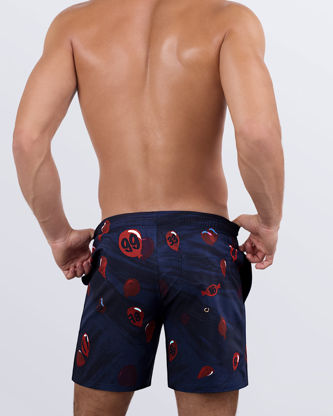 A back view of the 99 RED BALLOONS Resort Shorts, showcasing the elastic waistband, functional back pocket, and detailed balloon graphics.