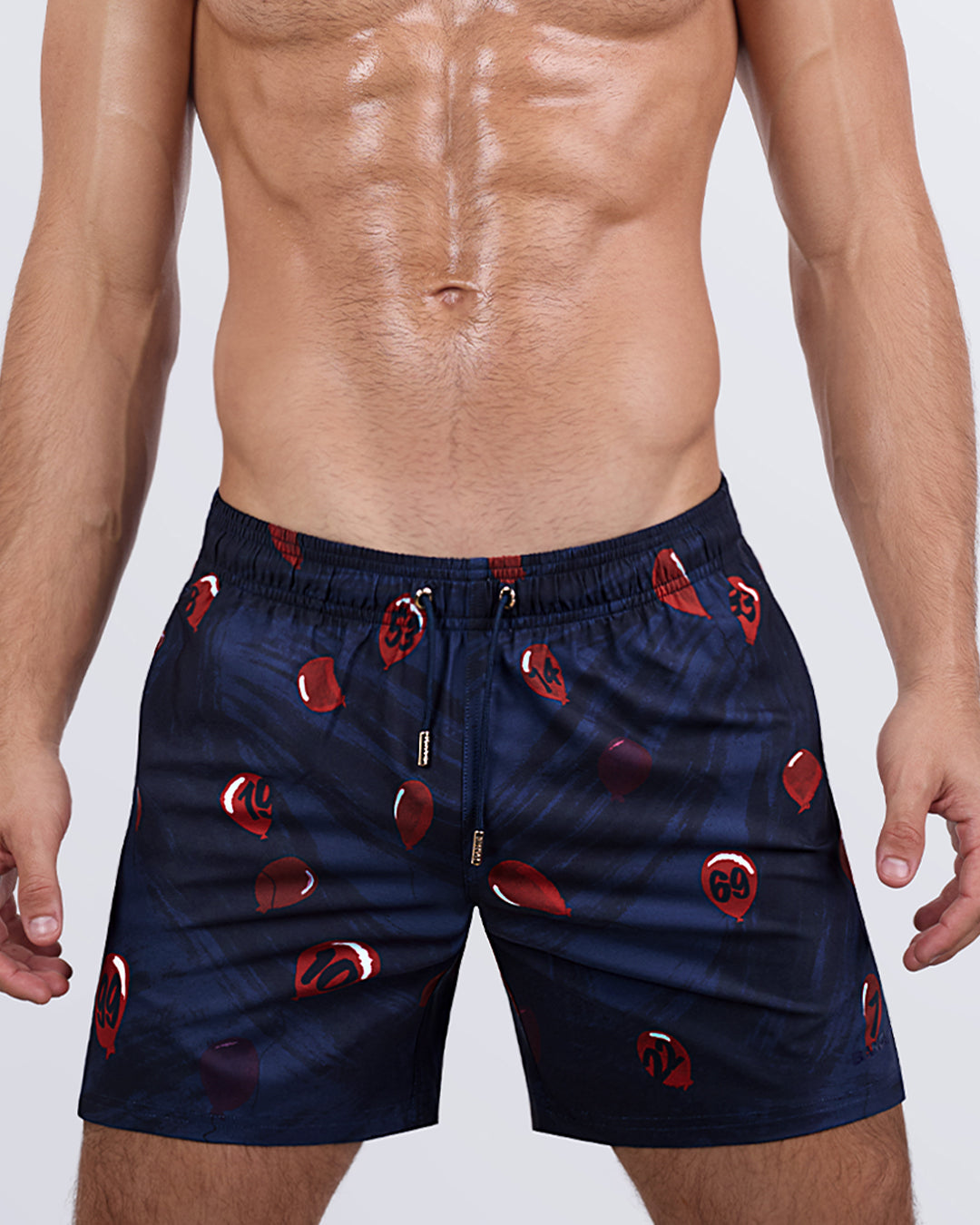 A straight-on view of the 99 RED BALLOONS Resort Shorts, highlighting the relaxed fit, breathable fabric, and bold print design for a standout beach look.