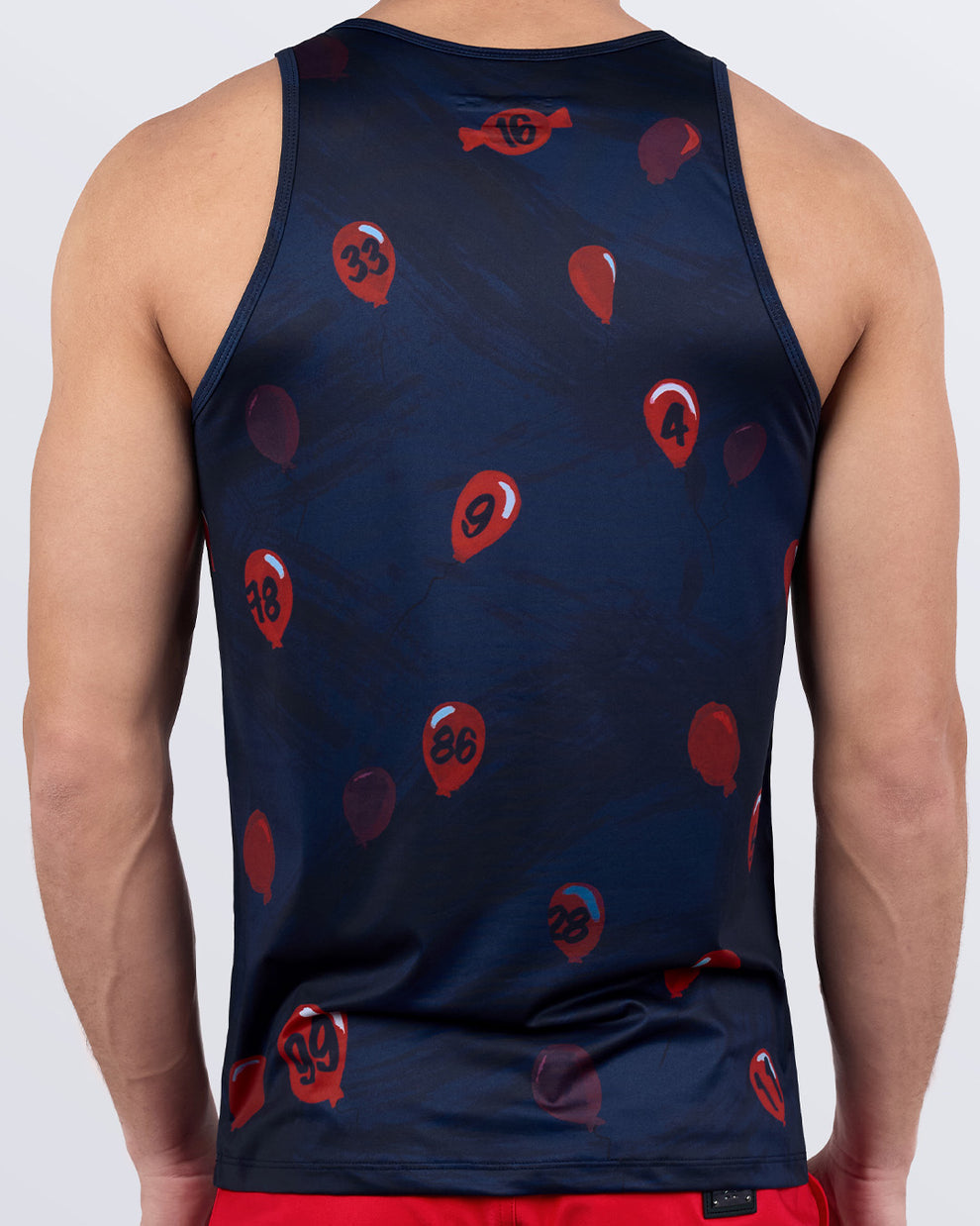 Back view of 99 RED BALLOONS men’s tank top – dark blue with red numbered balloon graphics – lightweight and moisture-wicking fitness wear