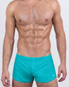 DC2 AQUA LITE — model wearing Aqua Lite Swim Shorts, featuring a bold cerulean hue and retro-inspired low-rise cut.