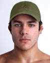 DC2 Resort Cap in army green worn by model, minimalist structured baseball cap with tonal embroidered logo.