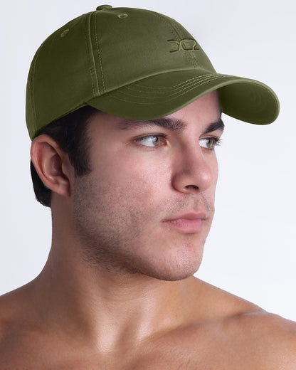 DC2 Resort Cap in olive green shown in profile, lightweight casual baseball cap designed for everyday wear.