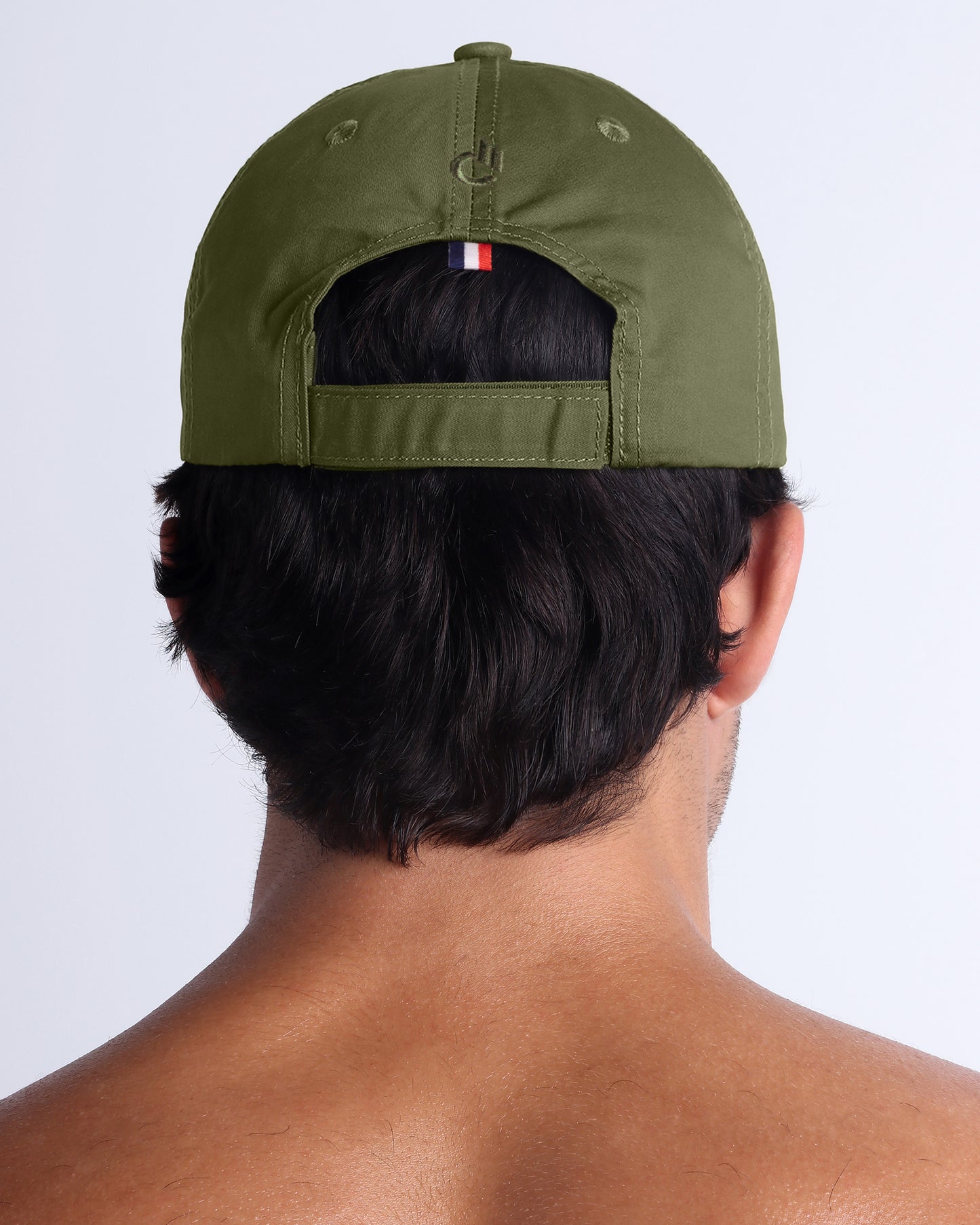 Back view of DC2 army green resort cap, adjustable strap detail and clean modern finish.