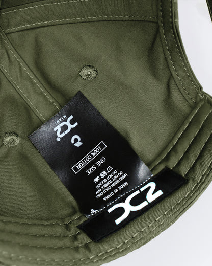 Interior view of the DC2 Army Green Resort Cap — showing soft cotton lining, branded label, and adjustable construction.