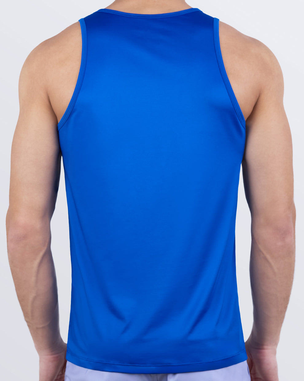 Back view of DC2 ASTRAL BLUE men's performance tank top in vibrant blue. Designed for flexibility, movement, and quick-dry comfort during workouts or active days.