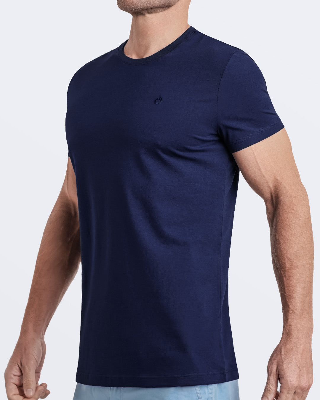 Side view of a men's premium navy blue modal cotton t-shirt and embroidered DC2 logo. Perfect for a modern casual look, this streetwear tee is part of the DC2 Miami men's beachwear collection, designed for comfort and style.