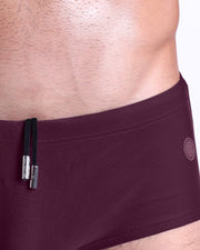 Close-up view of the BERRY GOOD men’s drawstring briefs showing black cord with custom branded metallic silver cord ends, and matching custom eyelet trims in silver.