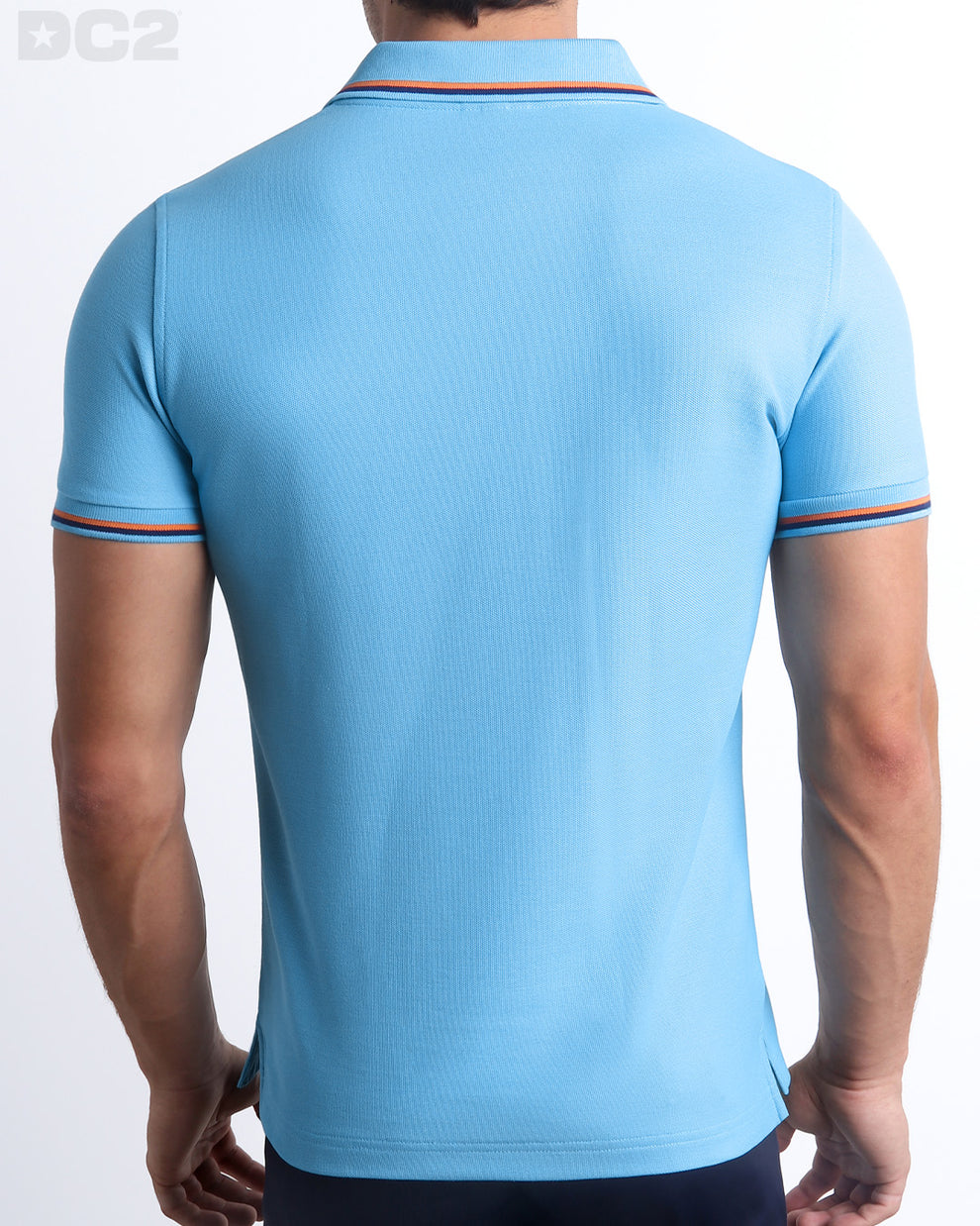 Back View of the BISCAYNE LIGHT BLUE Premium Cotton Polo Shirt for Men in solid light blue with orange and navy blue stripes on ribbed-knit collar and cuffs. The short-sleeve classic polo shirt is designed by DC2 in Miami.