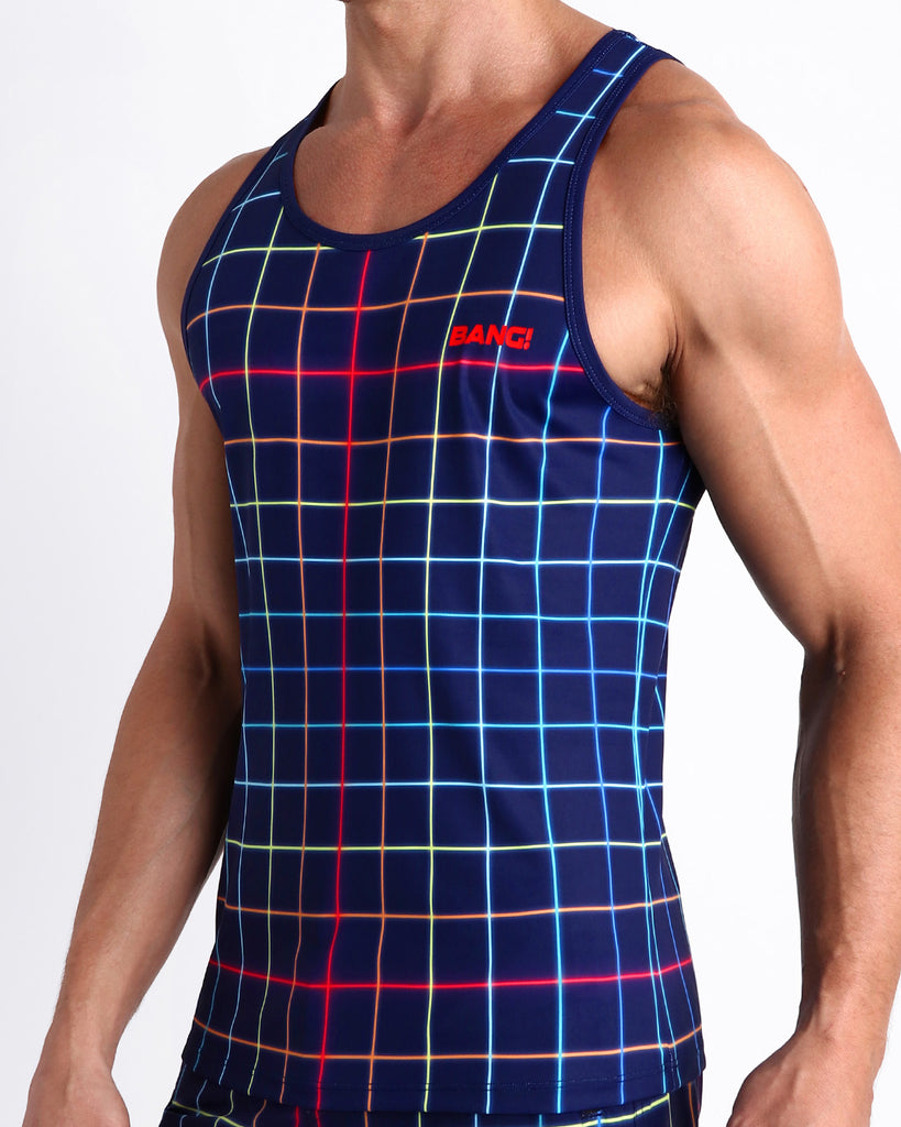 Side view of men’s casual tank top in BJORN THIS WAY (DARK) in dark blue with color stripes in red, orange, blue, green made by Miami based Bang brand of men's beachwear.