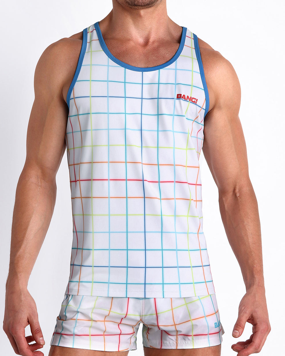 Front view of model wearing the BJORN THIS WAY men’s beach tank top in a white color with rainbow stripes by the Bang! Clothes brand of men's beachwear from Miami.