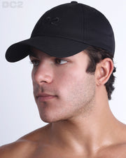Side view of the Chillax Cap in BLACK,  a dark black color, features ventilation eyelets on the cap to provide extra breathability, perfect for active wear.