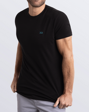 Side view of a men's premium black color Pima cotton t-shirt with embroidered DC2 logo. Perfect for a modern casual look, this streetwear tee is part of the DC2 Miami men's beachwear collection, designed for comfort and style.