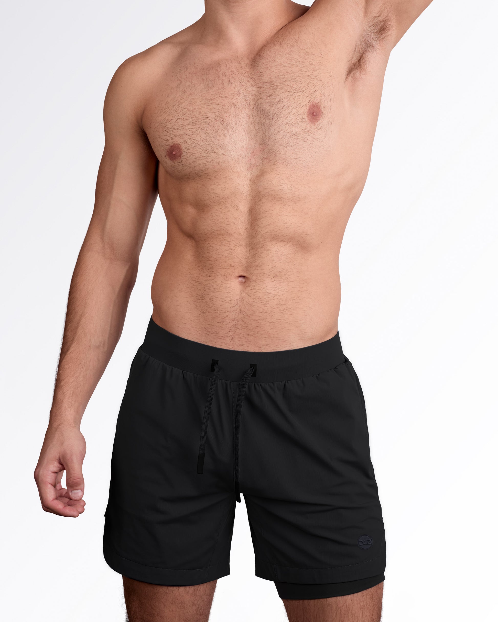 Man wearing lined gym workout shorts in black color from DC2 Miami fitness menswear.
