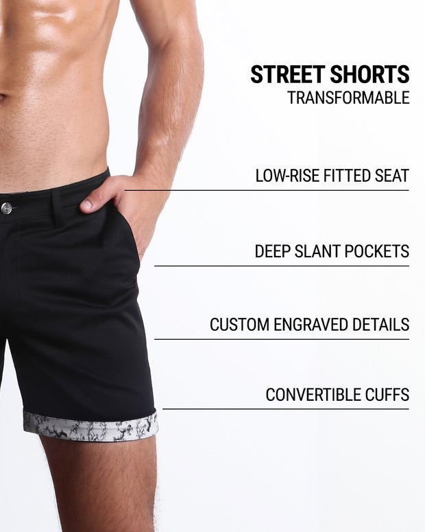 Men tailored fit chino shorts in BLACK FOR GOOD by DC2 Keeps you feeling comfortable and looking sharp all. Classic chino shorts for men in a cotton blend from DC2 Clothing from Miami. Features two front pockets and custom engraved button front closure with zip fly. Can roll-up cuffs for shorter length and showing internal print. Or hem down for a mid-thigh length and full-solid black color showing.