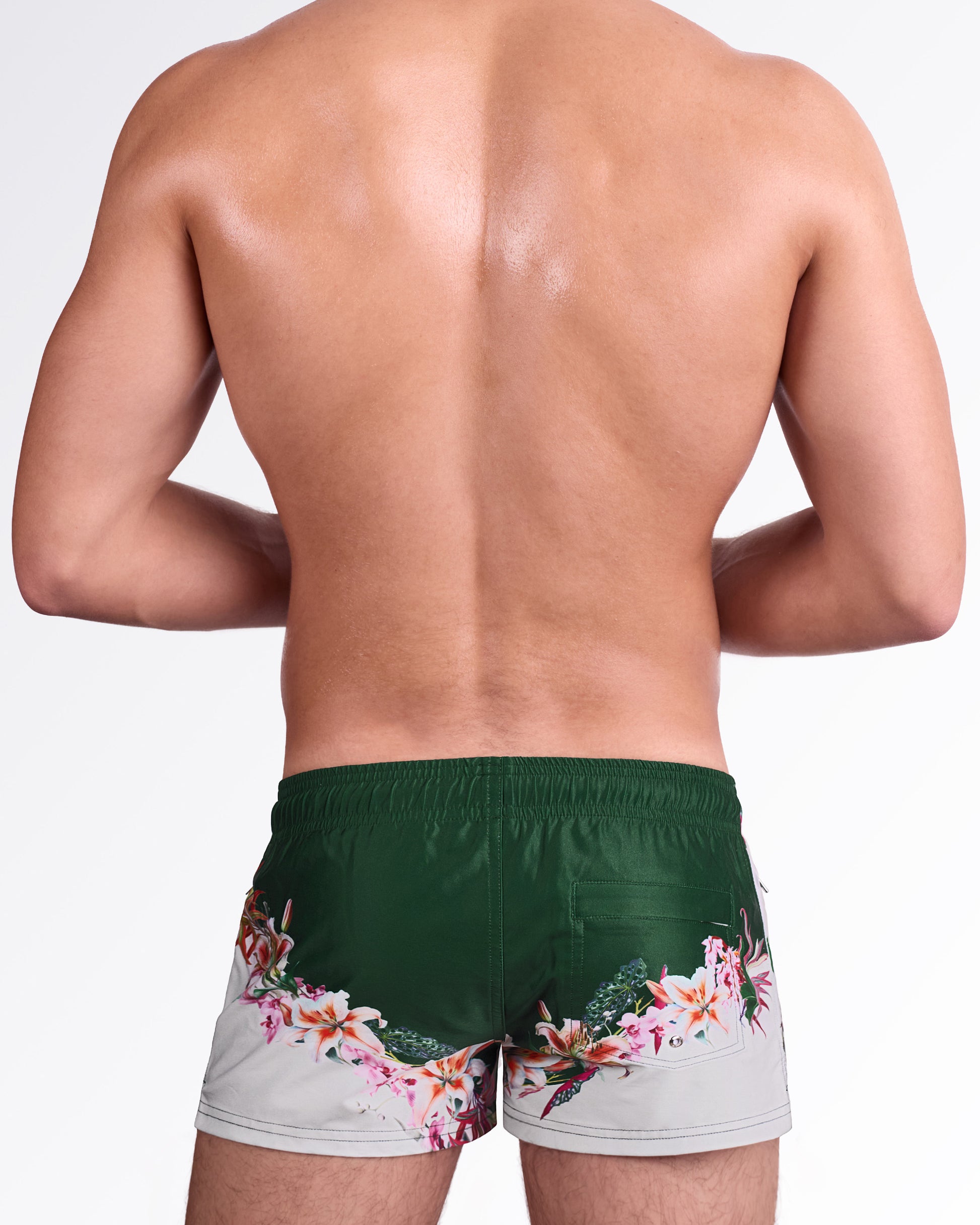 DC2 Bloom Service Poolside Shorts — back view showcasing the floral print wrapping across the lower back of the shorts along with the rear pocket design.