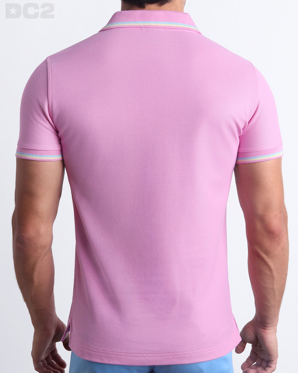 Back View of the BONBON PINK Premium Cotton Polo Shirt for Men in solid baby pink with yellow and aqua light blue stripes on ribbed-knit collar and cuffs. The short-sleeve classic polo shirt is designed by DC2 in Miami.