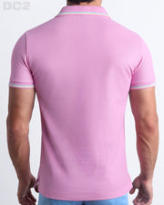 Back View of the BONBON PINK Premium Cotton Polo Shirt for Men in solid baby pink with yellow and aqua light blue stripes on ribbed-knit collar and cuffs. The short-sleeve classic polo shirt is designed by DC2 in Miami.