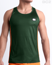 Male model wearing BRAVE GREEN men’s casual Tank Top. A premium quality top in a solid green color with vibrant orange and white stripes on the sides, a men’s beachwear brand from Miami.
