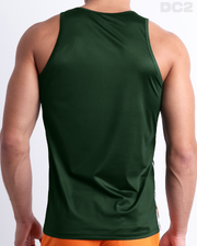 Male model wearing the men's BRAVE GREEN beach quick-dry tank top for men features a in a solid pine dark green color, made by DC2 a capsule brand by BANG! Clothes in Miami.
