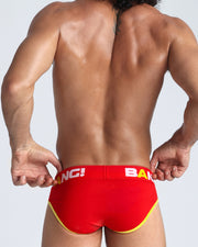 Back view of model wearing the BRAVO from the Sport line Men’s breathable cotton briefs in a bright red color for men by BANG! Offers light compression for perfect contouring to the body and second-skin fit.