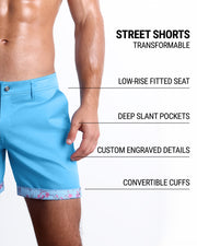 Men tailored fit chino shorts in BREEZY BLUE by DC2 Keeps you feeling comfortable and looking sharp all. Classic chino shorts for men in a cotton blend from DC2 Clothing from Miami. Features two front pockets and custom engraved button front closure with zip fly. Can roll-up cuffs for shorter length and showing internal print. Or hem down for a mid-thigh length and full-solid white color showing.