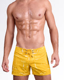 BANG! Miami Brush Rush (Yellow) Flex Shorts — model wearing men’s yellow swim shorts with abstract brushstroke print, featuring adjustable drawstring waistband and tailored poolside fit.