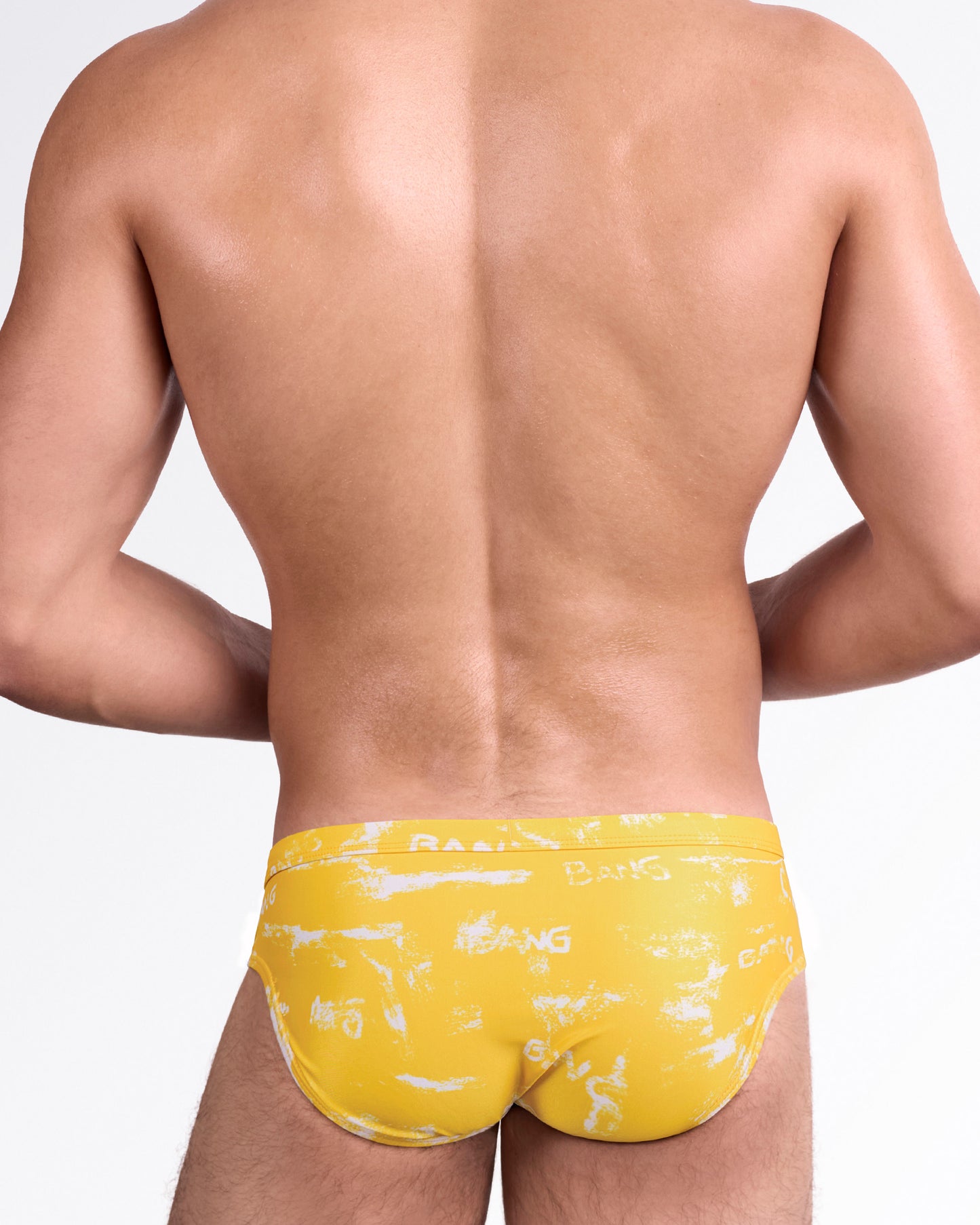 BANG Brush Rush Yellow Swim Brief — back view highlighting full rear coverage with allover abstract brush pattern and seamless waistband finish.
