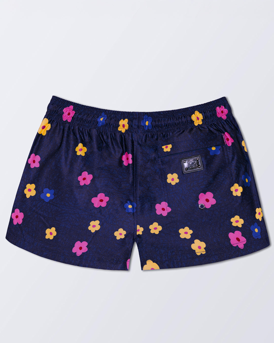 DC2 BUY MYSELF FLOWERS (COOL) Poolside Shorts — back view with zip pocket and bold multicolor flowers.